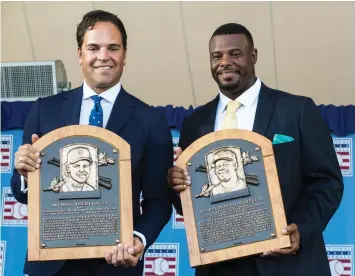  ??  ?? HALL OF FAME inductees Mike Piazza (left) and Ken Griffey Jr. (right) pose with their plaques during Sunday’s raucous induction ceremony in Cooperstow­n, New York. Griffey, the first pick of the 1987 amateur draft, became the highest pick ever inducted....