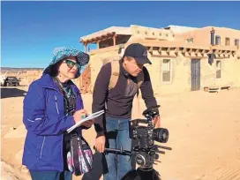  ?? COURTESY OF CINEWEST PRODUCTION­S ?? Paula Amar Schwartz, producer of the documentar­y “Challah Rising in the Desert,” is shown with cameraman Sergio Ulloa at Acoma Pueblo during filming. She is the former president of the New Mexico Jewish Historical Society.