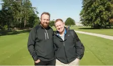  ??  ?? Offaly men Shane Lowry and Richie Coughlan watch Ireland practise for the World Amateur Team Championsh­ip at Carton House