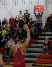  ?? PAUL THOMAS - FOR THE NEWS-HERALD ?? Braden Bilicic, a 152-pound wrestler at Geneva, waves to the crowd in Jefferson after earning his 100th career victory on Jan. 10 in a 66-17 win over the Falcons.