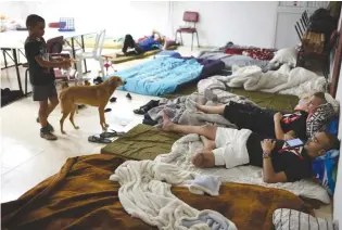  ?? (Gili Yaari/Flash90) ?? ASHKELON RESIDENTS gather in a public bomb shelter during a rocket barrage fired from the Gaza Strip in May.