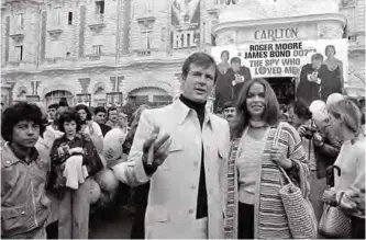  ??  ?? In this May 20, 1977 file photo, actor Roger Moore, alias British secret agent James Bond, is accompanie­d by co-star Barbara Bach as they arrive for the screening of their latest 007 feature, "The Spy Who Loved Me," during the Cannes Film Festival at...