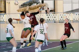  ?? Mark Ross/Special to the Herald-Leader ?? Siloam Springs’ Chaney Stanaland (right) goes into the air against Alma’s Olivia Reed during a game on March 14 at Panther Stadium. Siloam Springs defeated Alma 6-0.