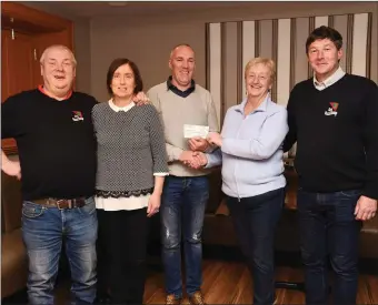  ??  ?? Sheila O’Donoghue Lotto Officer (fourth rom left) presenting the Fossa Lotto cheque for €4500 to winner Rhona and Willie Buckley with (left) Dermot Clifford Club Chairman and (right) Merry Talbot Club Secretary at the Golden Nugget, Fossa Killarney on...