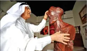  ?? YASSER AL-ZAYYAT/AFP ?? Kuwaiti sculptor Sami Mohammed poses with one of his works at the Museum of Modern Art in Kuwait City on October 4.