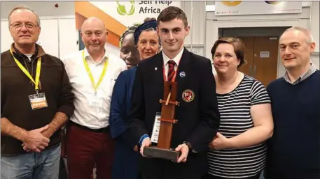  ??  ?? Sean Byrne with his parents (right) and staff from Self Help Africa’s Developmen­t Education team (left), at the Self Help Africa stand, BT Young Scientist Exhibition 2019.