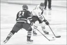  ?? CAROLE MORRIS-UNDERHILL ?? Nathan Clarke races across the ice to intercept the Penguins’ Alex Anthony.