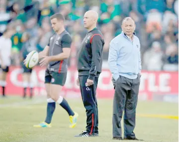  ??  ?? England coach Eddie Jones (right) looks on during the warm up of the second test match at the Free State Stadium in Bloemfonte­in, in this June 16 file photo. — AFP photo