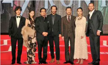  ??  ?? The cast at the premiere (from left) Jin akanishi, Ko Shibasaki, hiroyuki Sanada, Keanu reeves, Tadanobu asano, rinko Kikuchi and director carl rinsch.