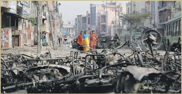  ?? Reuters ?? The aftermath in a riot-affected area of New Delhi yesterday after clashes between people demonstrat­ing for and against a new citizenshi­p law.