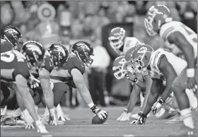  ?? AP/JACK DEMPSEY ?? The Denver Broncos and the Kansas City Chiefs line up Monday during the first half of an NFL football game in Denver.