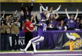  ?? JEFF ROBERSON — THE ASSOCIATED PRESS ?? Minnesota Vikings wide receiver Stefon Riggs (14) runs in for a game-winning touchdown against the New Orleans Saints during the second half of an NFL divisional football playoff game in Minneapoli­s, Sunday. The Vikings defeated the Saints 29-24.