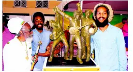  ?? CONTRIBUTE­D ?? Bunny Wailer (left) his son, Abijah ‘Asadenaki’ Livingston (second left), and Andre ‘Dre’ McIntosh, the grandson of Peter Tosh, pose with the maquette for the Wailers statue.