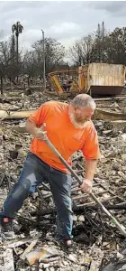  ?? THE ASSOCIATED PRESS ?? Gerald Peete digs for belongings in the burned remains of his daughter’s home Friday in Santa Rosa, Calif.