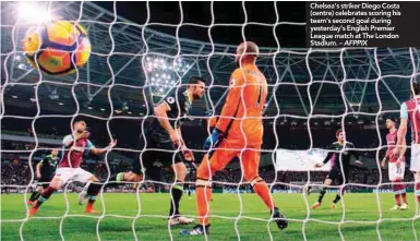  ??  ?? Chelsea’s striker Diego Costa (centre) celebrates scoring his team’s second goal during yesterday’s English Premier League match at The London Stadium. – AFPPIX well opted for a low cross to the front post while Carroll was waiting for a header at the...