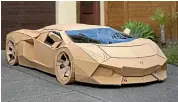  ?? ?? A cardboard model of a Lamborghin­i that first sold on Trade Me for more than $10,000 has been auctioned once more, with all proceeds going to charity.