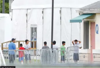  ?? AP ?? FLORIDA Children walk outside the Homestead Temporary Shelter for Unaccompan­ied Children.