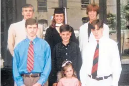  ?? COURTESY OF WHITE FAMILY ?? Maureen White, top middle, is surrounded by her family during her graduation. She is the sole White sibling who is not involved in college athletics, instead choosing a teaching path. “She’s the only one of us smart enough not to work in college sports,” said brother Danny White.