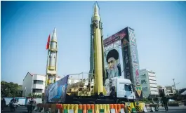  ?? (Nazanin Tabatabaee Yazdi/Reuters) ?? A PICTURE OF Iran’s Supreme Leader Ayatollah Ali Khamenei is displayed next to missiles in Tehran in September 2017.