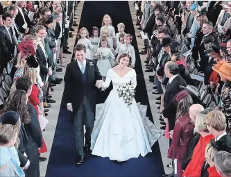  ?? WPA POOL ?? Princess Eugenie of York and Jack Brooksbank walk down the aisle following their marriage at St. George’s Chapel in Windsor Castle.