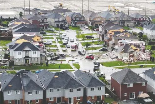  ?? EDWARD LOVELESS / SOCIAL MEDIA VIA REUTERS ?? An aerial view shows damage to buildings in the aftermath of a tornado in Barrie in this still image obtained from video.