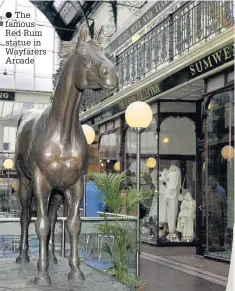  ??  ?? The famous Red Rum statue in Wayfarers Arcade