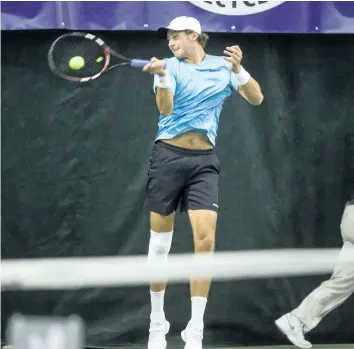  ?? BOB TYMCZYSZYN/POSTMEDIA NETWORK ?? Canadian Brayden Schnur returns a shot in the singles final at the Bruno Agostinell­i Futures Tennis Tournament held at White Oaks tennis facility Sunday.