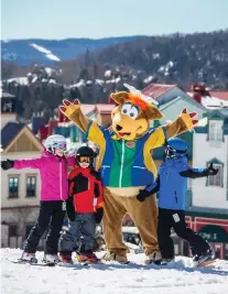  ??  ?? Tremblant’s resort village hosts free entertainm­ent for children, including visits with mascot Toufou.