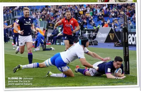  ?? ?? SLIDING IN: Johnson gets over the line to score against Italians