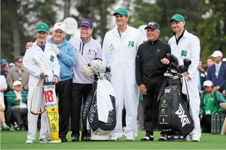  ?? — ap ?? nicklaus (second left) with his wife Barbara, and Watson and player (second right) with their caddies.