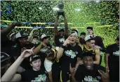  ?? JOHN LOCHER — THE ASSOCIATED PRESS ?? Oregon celebrates beating Colorado in the championsh­ip of the Pac-12 tournament Saturday in Las Vegas.