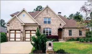  ?? PHOTOS BY LINDA GARNER-BUNCH/Arkansas Democrat-Gazette ?? In addition to four bedrooms and three baths, this home offers an open great room, and there are two spacious living areas on the second  oor.