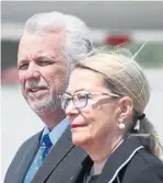  ?? LUDOVIC MARIN/AFP/GETTY IMAGES ?? Philippe Couillard (seen with his wife, Suzanne Pilote) held a senior portfolio prior to becoming a leader and, by comparison to Ford, knows policy files inside out.