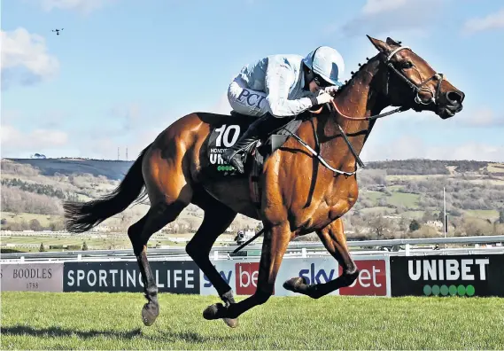  ??  ?? First past the post: Rachael Blackmore on Honeysuckl­e wins the Champion Hurdle at Cheltenham yesterday, after destroying the field to romp to a historic victory by 6½ lengths