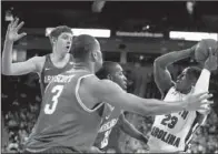  ?? McClatchy Newspapers/C. MICHAEL BERGEN ?? South Carolina’s Bruce Ellington (23), who is surrounded by (from left) Hunter Mickelson, Rickey Scott and Fred Gulley, scored 14 points and held Arkansas’ BJ Young to seven points.