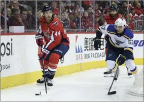  ?? NICK WASS - THE ASSOCIATED PRESS ?? Washington Capitals defenseman Brooks Orpik (44) skates with the puck against St. Louis Blues left wing David Perron (57) during the first period of an NHL hockey game, Monday, Jan. 14, 2019, in Washington.