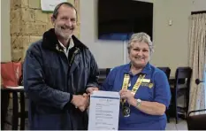  ?? Picture: TK MTIKI ?? CHEQUE HANDOVER: Rotary Port Alfred president Petro Horner with SPCA administra­tor Forbes Coutts at the Royal Marina Port Alfred.