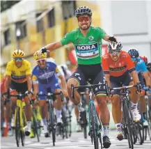  ?? CHRISTOPHE ENA/ASSOCIATED PRESS ?? Slovakia’s Peter Sagan, wearing the best sprinter’s green jersey, crosses the finish line Wednesday to win the fifth stage of the Tour de France with start in Lorient and finish in Quimper, France.