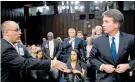  ?? Photo / AP ?? Fred Guttenberg tries to shake Brett Kavanaugh’s hand.