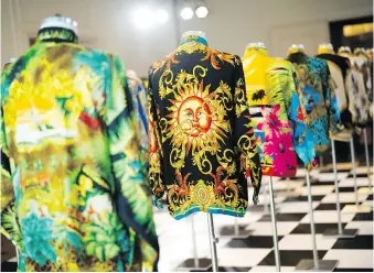  ?? PHOTOS: MARKUS SCHREIBER/THE ASSOCIATED PRESS ?? “Such an overview of his work is something special,” says Karl von der Ahe, co-curator of the new Gianni Versace Retrospect­ive now on display in Berlin.