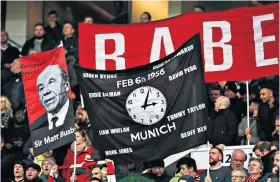  ??  ?? In memory: Manchester United fans held up banners at Old Trafford on Saturday