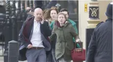  ?? — AFP ?? People leave after being evacuated from the Houses of Parliament in central London on Wednesday during an emergency incident.