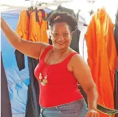  ?? Photo: Salote Qalubau ?? Francis Natadra with some of the overalls sold at her stall in the Navutu, Lautoka Flea Market.