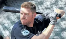  ?? CURTIS COMPTON/THE ASSOCIATED PRESS ?? Atlanta Braves first baseman Freddie Freeman takes batting practice during spring training baseball in Lake Buena Vista, Fla. on Feb. 20. The all-star firest baseman is playing for Canada at the World Baseball Classic to honour the memory of his later...
