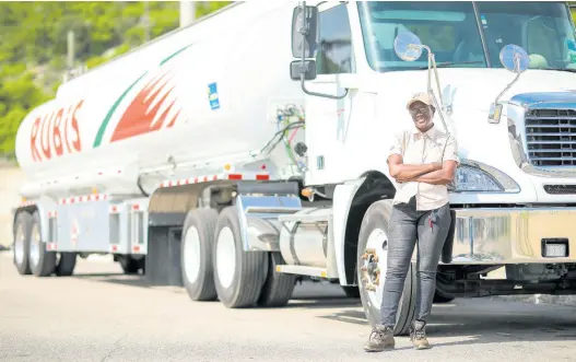  ?? CONTRIBUTE­D ?? Carol Clarke poses alongside a RUBiS trailer truck.