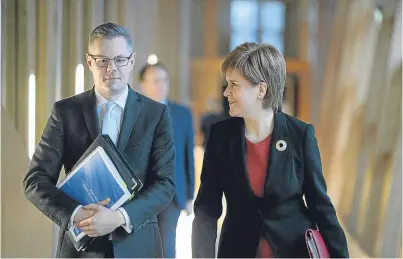  ??  ?? SNP Finance Secretary Derek Mackay with First Minister Nicola Sturgeon before the budget.