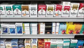  ?? MARK LENNIHAN / ASSOCIATED PRESS 2017 ?? In recent years, Hawaii has hiked taxes and regulation­s and become the first state to ban smoking for people younger than 21. But a new bill aims to raise the legal minimum age to purchase or possess cigarettes to 100 by 2024.