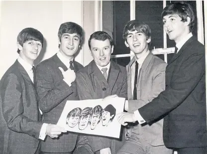  ??  ?? DC Thomson artist Fraser Elder, centre, with The Beatles and one of his drawings, which the band signed while they were in Dundee for their concert at the Caird Hall in 1963.