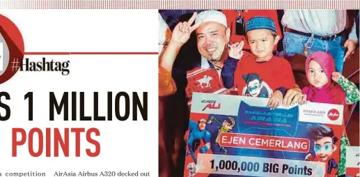  ??  ?? Ejen Ali “Ejen Ali Muhammad Adam Rashidi Mohd Rafiq (centre) won one million AirAsia Big points with his 15-second video on ‘Ejen Ali’.