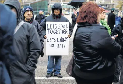  ?? CP PHOTO ?? People gather for a vigil to stand together in solidarity against violence after a terrorist incident in Edmonton on Sunday.